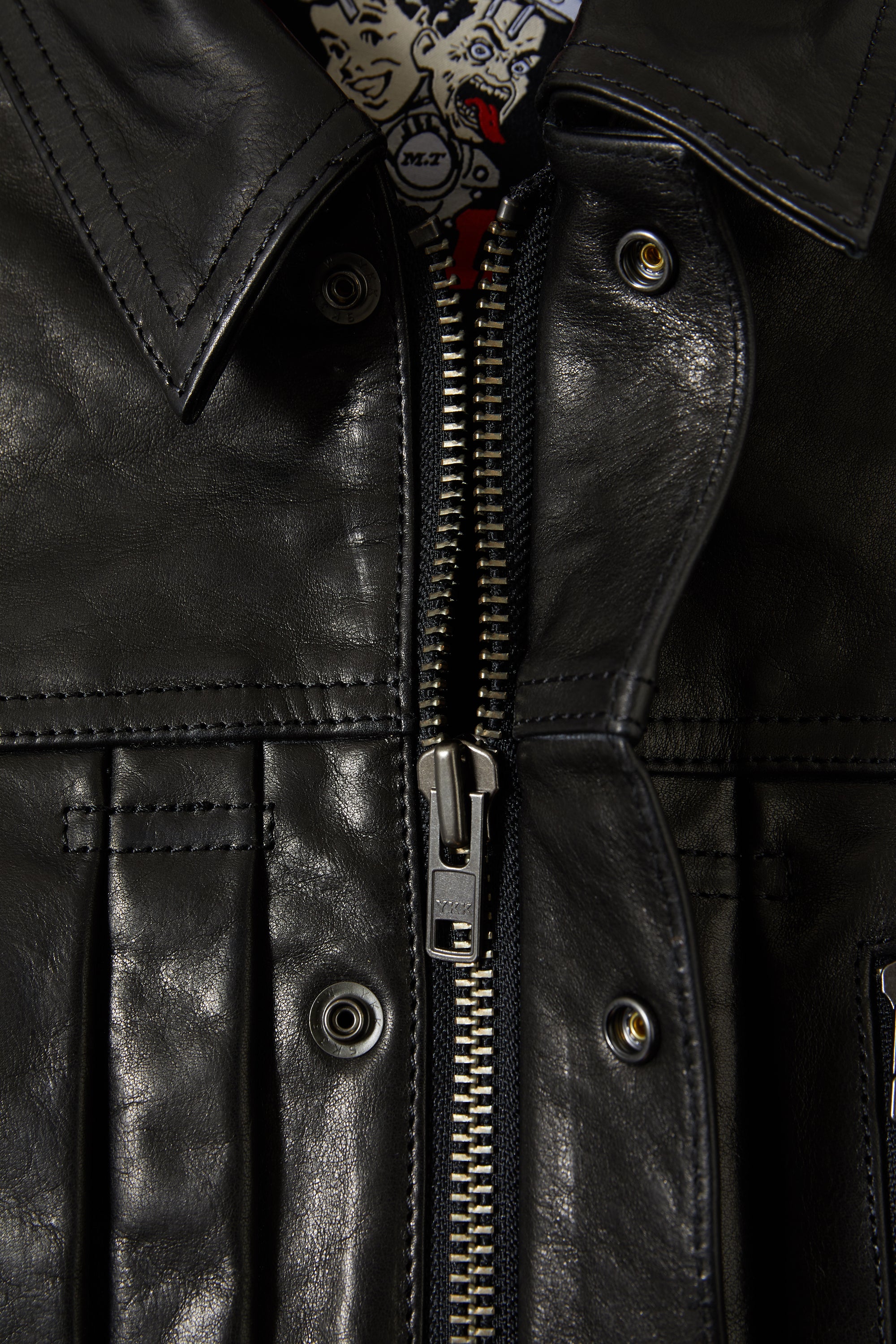YKK metal hardware and two-way front zip on the 001.LEATHER.JACKET