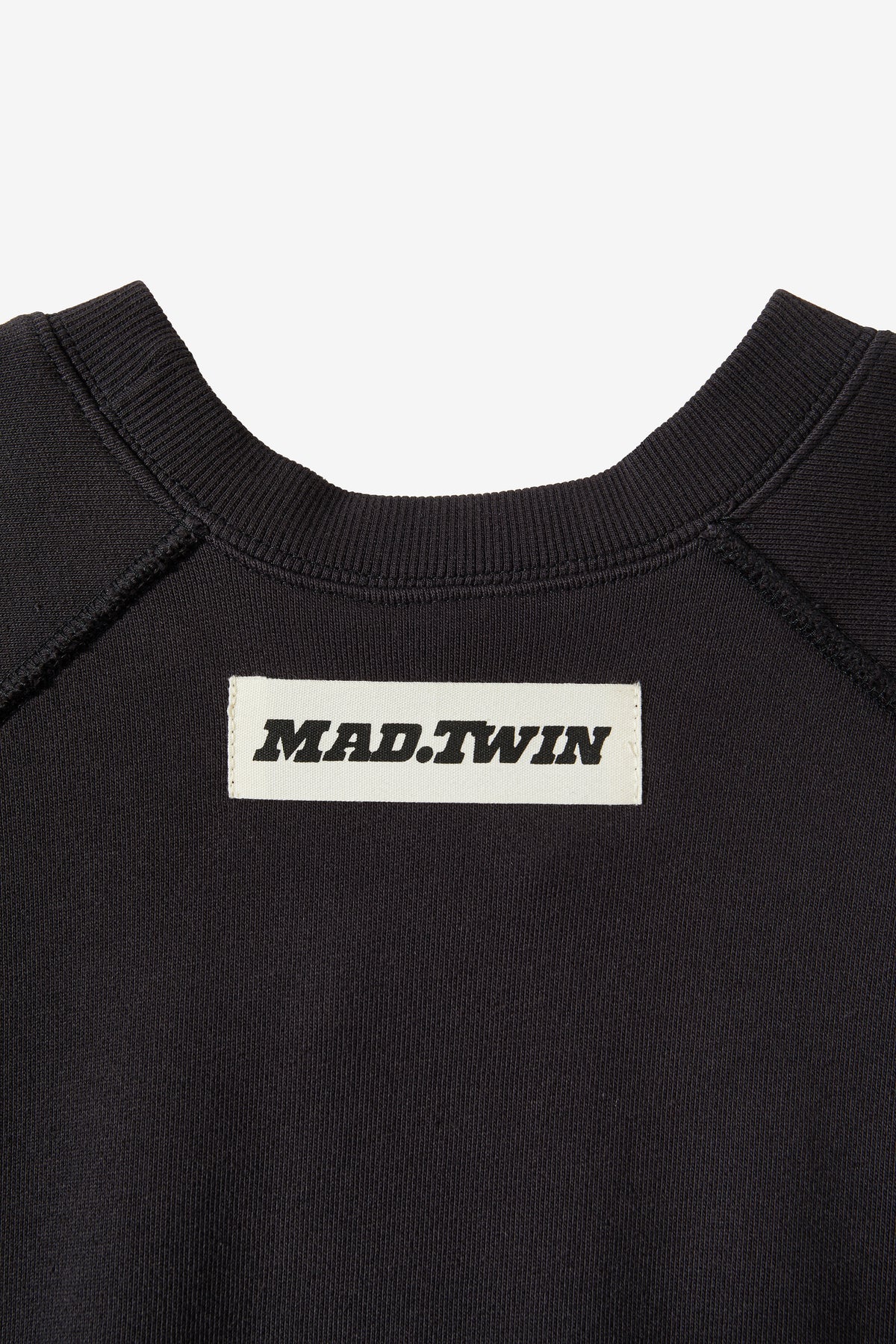 Heavy ribbing at the neck, cuffs and hem of the FLAME.CREW