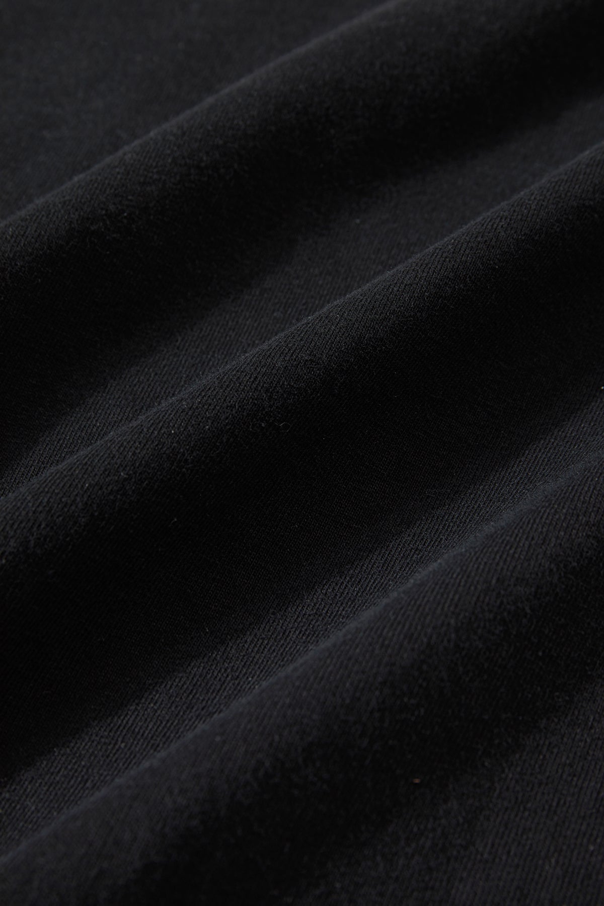 Straight hem and worn-in character on the YOU.AIN'T.TEE